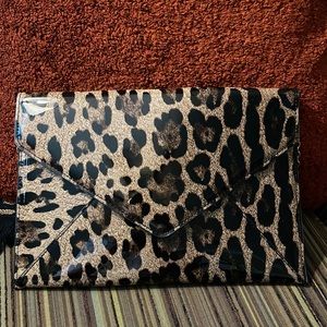 Animal print envelope style clutch purse. Never used. NWOT.